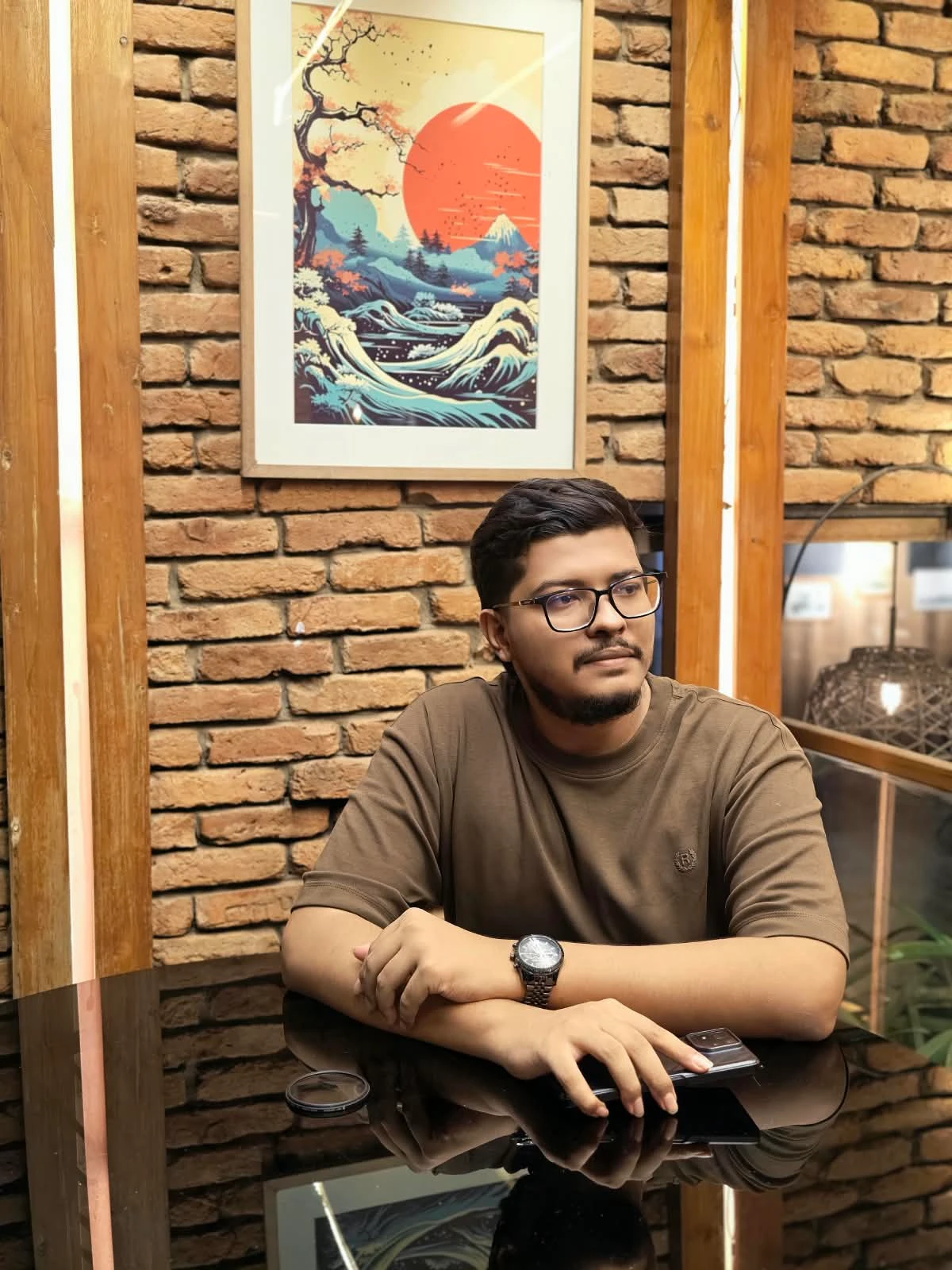Tanzimul Karim seated at a table.